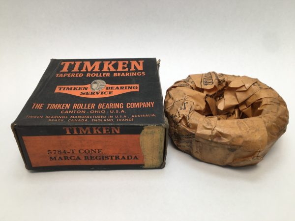 Timken 5784-T tapered roller bearing cone next to its original box, still wrapped in paper