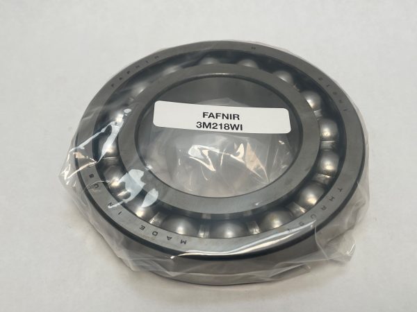 Open angular contact ball bearing in plastic packaging labeled Fafnir 3M218WI