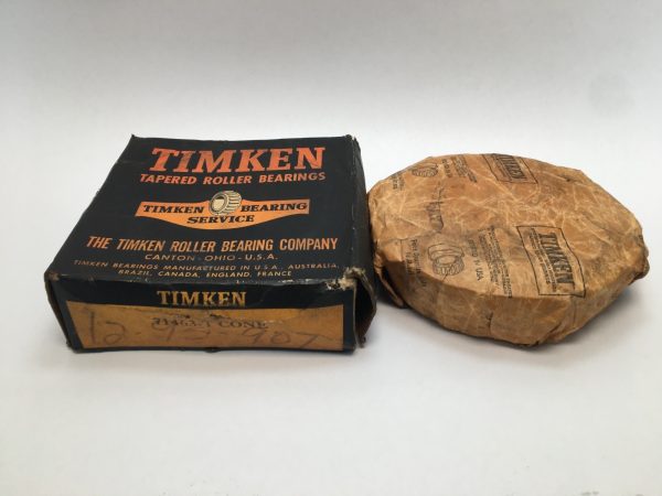 Timken 71463T tapered roller bearing cone in original box next to paper-wrapped bearing