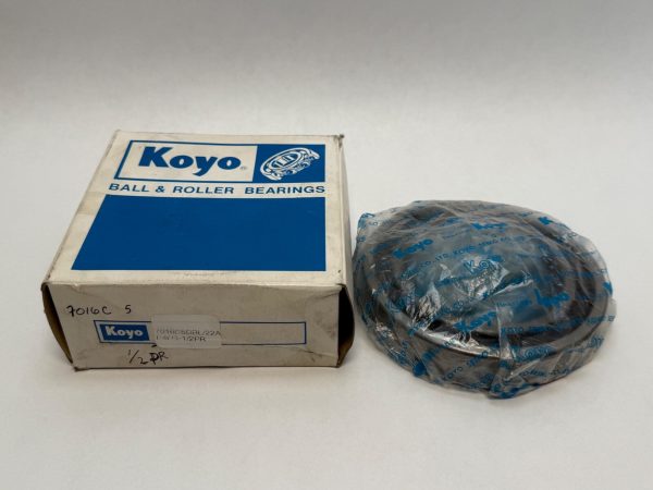 Koyo 7016C5DBL22AP4 angular contact ball bearing, shrink-wrapped, beside its original Koyo box