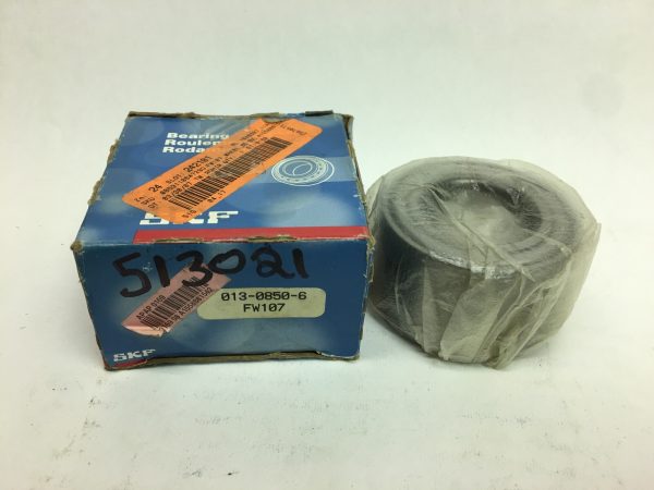 SKF FW107 double row wheel bearing, plastic-wrapped, next to its original SKF box