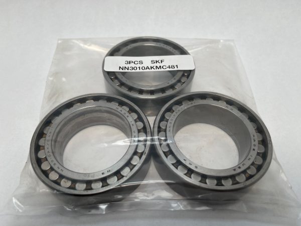Three SKF NN3010AKMC481 double row cylindrical roller bearings in a labeled plastic bag