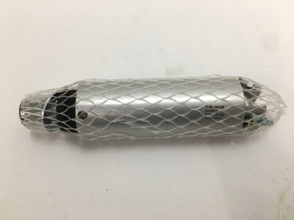 Festo E-40-50-SA pneumatic round cylinder wrapped in protective netting, showing printed label