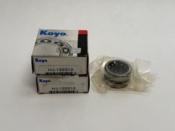 Koyo HJ-122012 needle roller bearing shown unwrapped beside two stacked Koyo boxes labeled HJ-122012