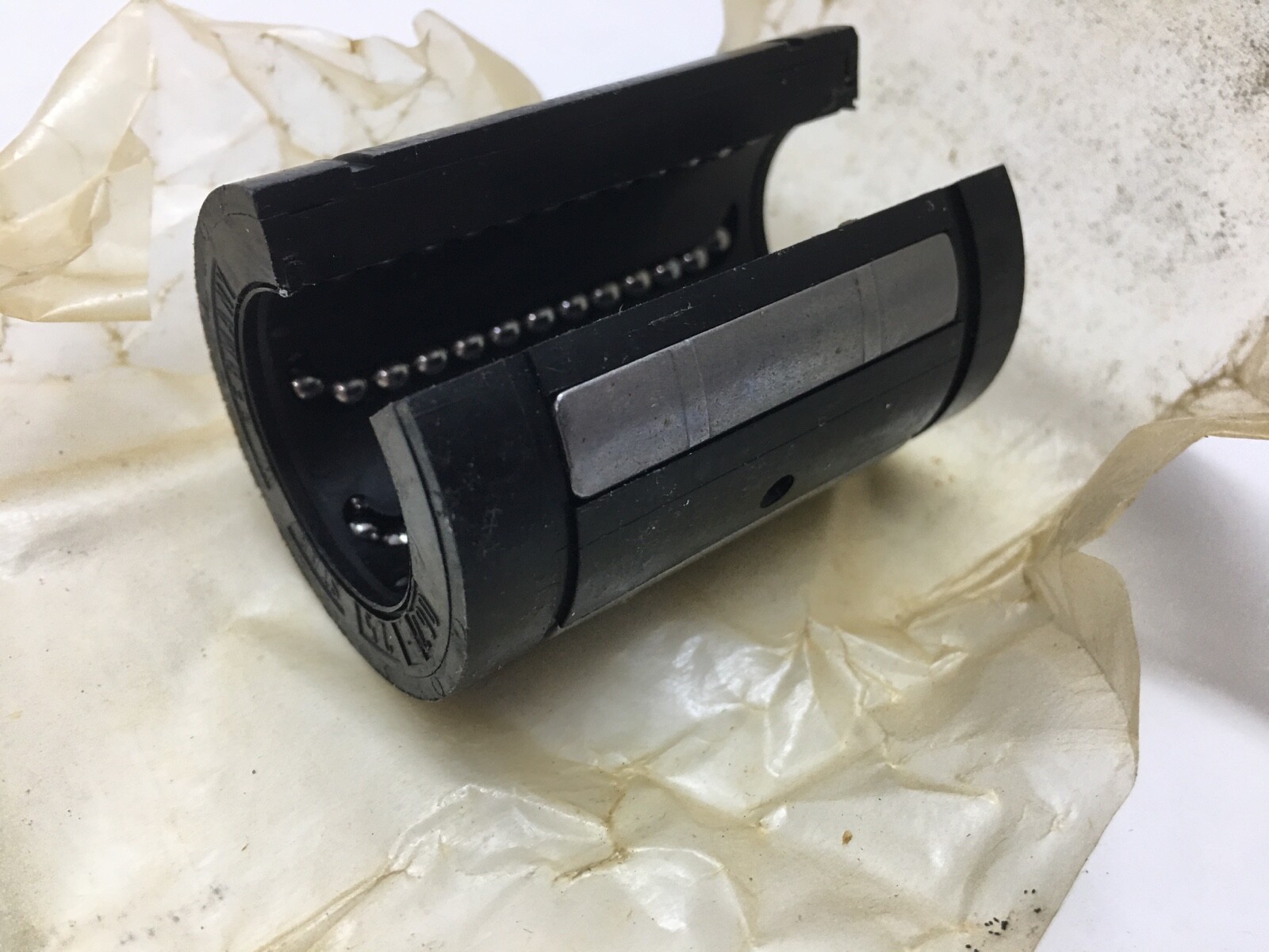 Different types of linear bearings on a workbench