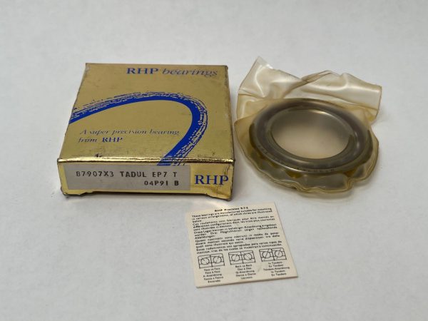 RHP 7907ETDULP4 angular contact ball bearing in plastic wrap next to its gold RHP bearings box and instruction card