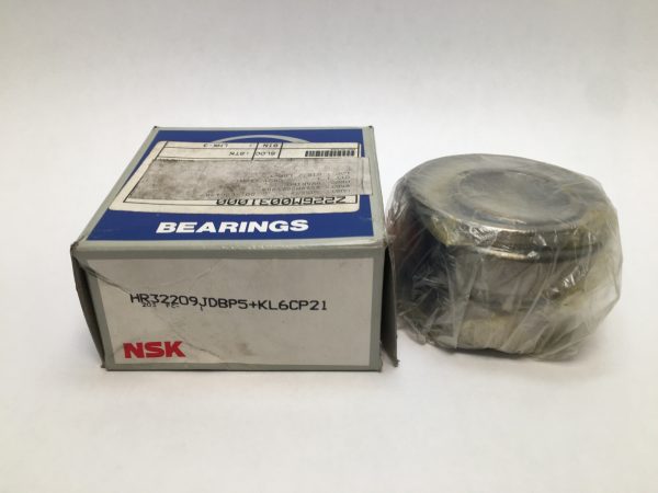 NSK HR32209JDBP5+KL6CP21 tapered roller bearing pair, shrink-wrapped, beside its labeled box