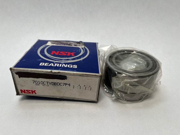 NSK 7010CTYDBDC7P4 angular contact ball bearing set, shrink-wrapped, next to its NSK box