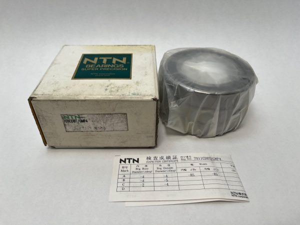 NTN 7011CDBTGMP4 angular contact ball bearing triplex set, shrink-wrapped, beside its box and inspection certificate