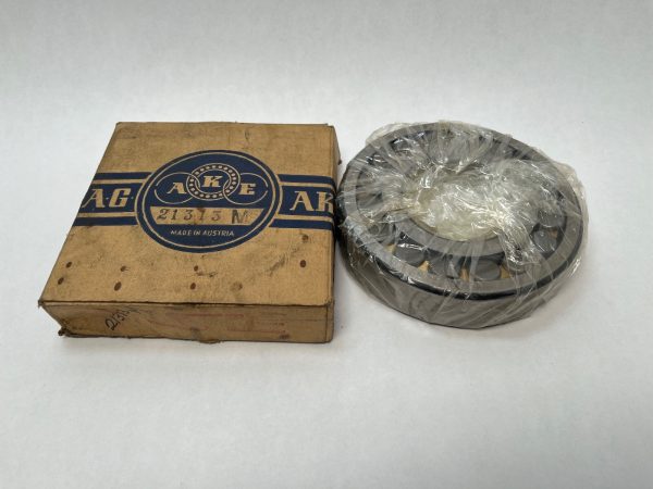 AKE 21313M spherical roller bearing, shrink-wrapped, next to its original AKE cardboard box
