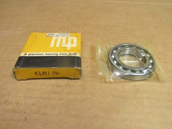 RHP KLNJ1-1/4 deep groove ball bearing in plastic wrap beside its original yellow RHP box