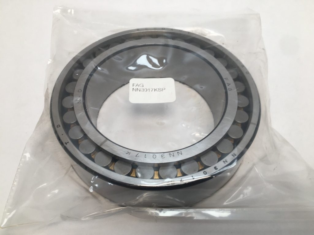 FAG NN3017KMSP double-row cylindrical roller bearing sealed in plastic with label showing part number