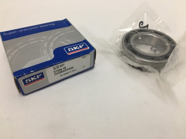SKF S7006 CE/HCDBG2VK353 angular contact ball bearing in plastic sleeve next to its SKF box