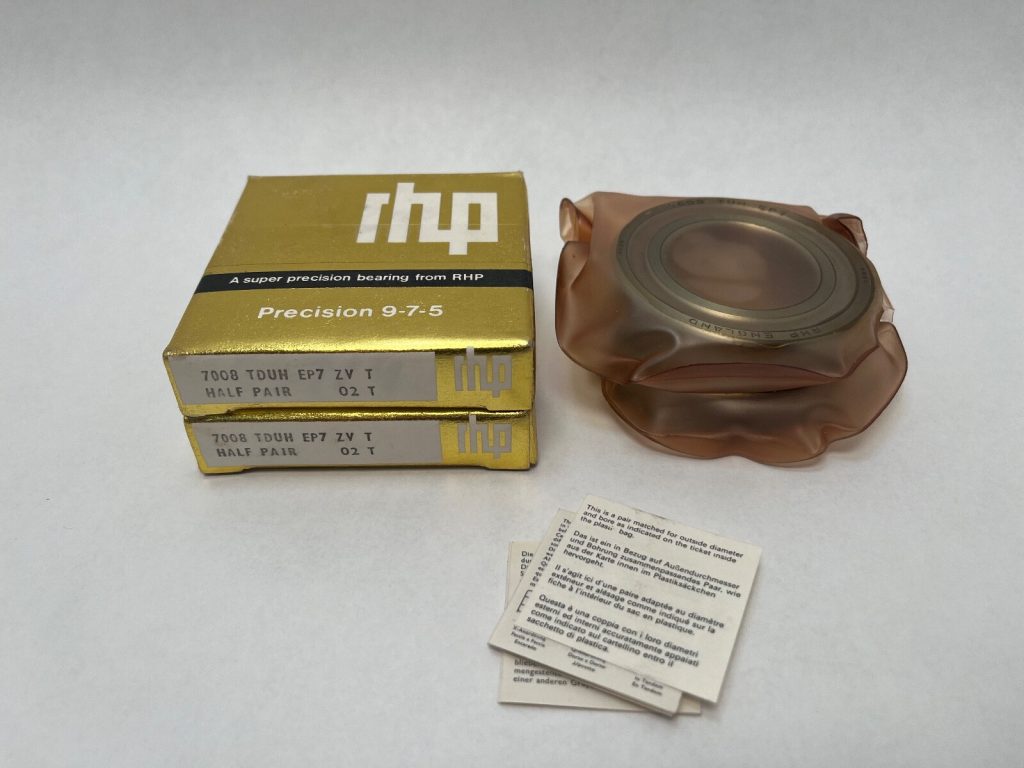 RHP 7008 TDUH EP7 bearing pair in gold boxes beside a bearing wrapped in plastic with instruction cards