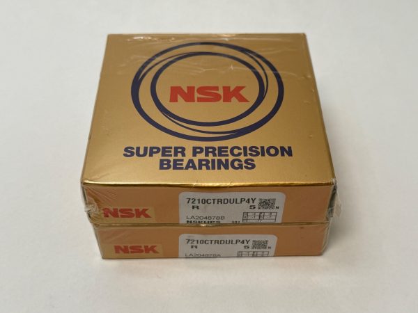 Two gold NSK Super Precision Bearings boxes labeled 7210CTRDULP4Y, shrink-wrapped and stacked