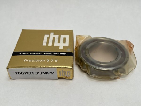 RHP 7007CTSUMP2 angular contact ball bearing in plastic wrap next to its gold RHP packaging box