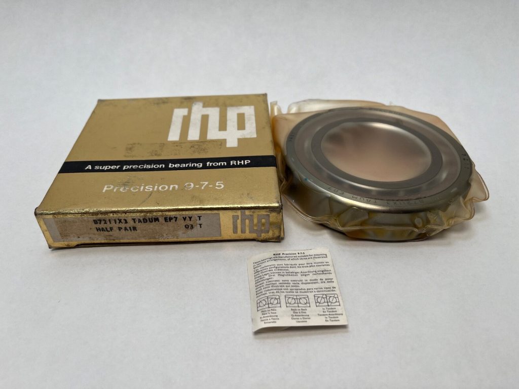 RHP 7211ETSUMP4 angular contact ball bearing, wrapped, beside its labeled RHP Precision 9-7-5 box