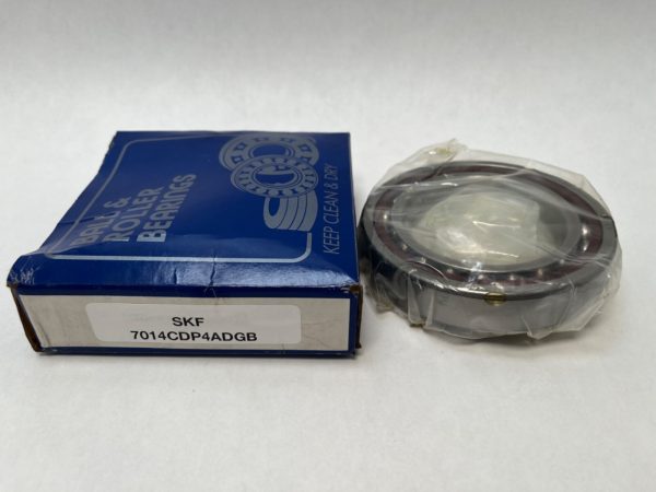 SKF 7014CDP4ADGB angular contact ball bearing, shrink-wrapped, next to its labeled SKF box