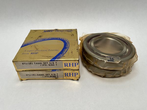 RHP 7212CTDULP4 angular contact ball bearing duplex pair, wrapped, next to two gold RHP boxes