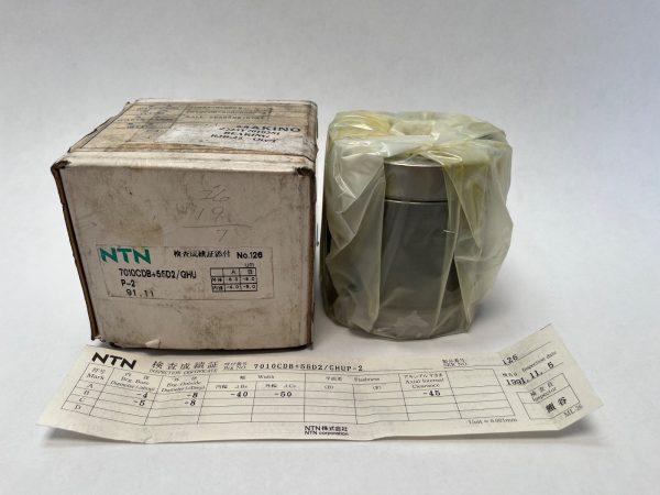 NTN 7010CDBGHUP2 bearing pair wrapped in plastic beside original labeled box and inspection certificate