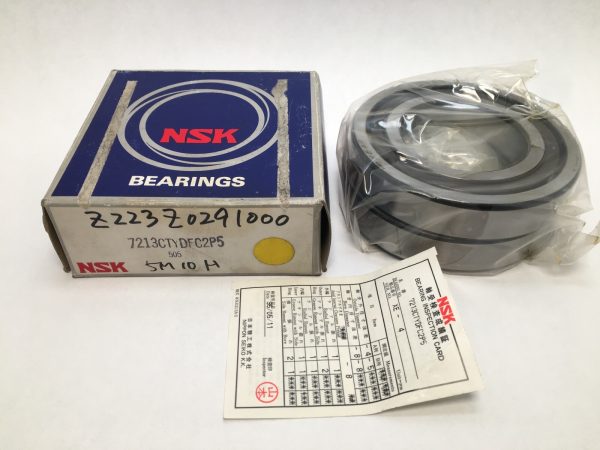 NSK 7213CTYDFC2P5 angular contact ball bearing pair in plastic wrap next to its labeled NSK box and inspection card