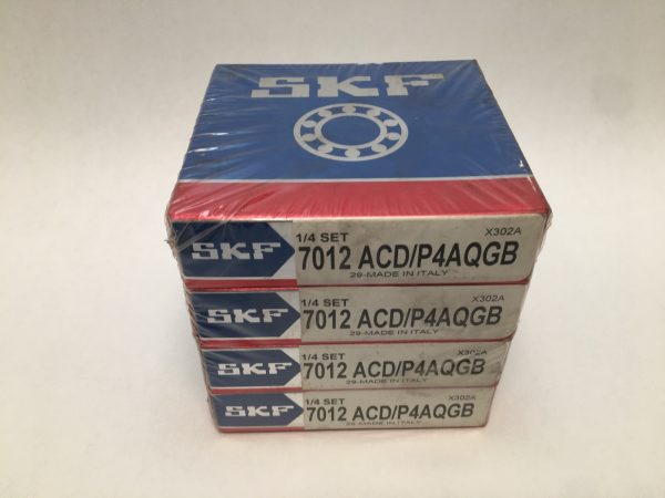 Stack of four sealed SKF 7012 ACD/P4AQGB bearing boxes, shrink-wrapped, labeled 1/4 set
