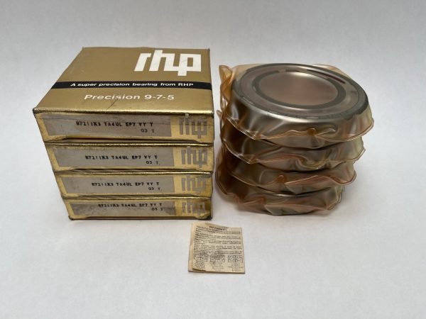 Four RHP 7211ETQULP4 angular contact ball bearings in individual plastic wrap, stacked beside their labeled boxes