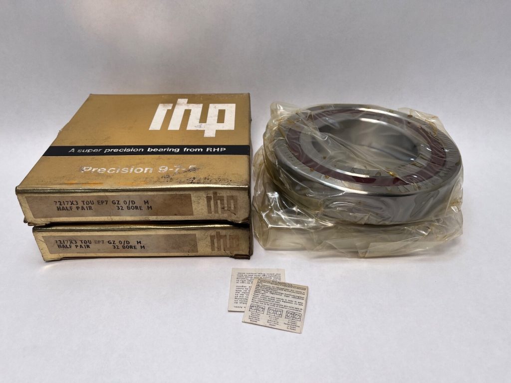 RHP 7217ETDULP4 angular contact ball bearing matched pair, wrapped in plastic, beside two labeled RHP boxes