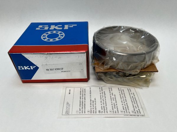 SKF double-row cylindrical roller bearing in shrink wrap beside its box and instruction sheet