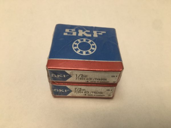 Two SKF 71904 ACX/P4ADGA bearing boxes, each labeled 1/2 set, stacked together