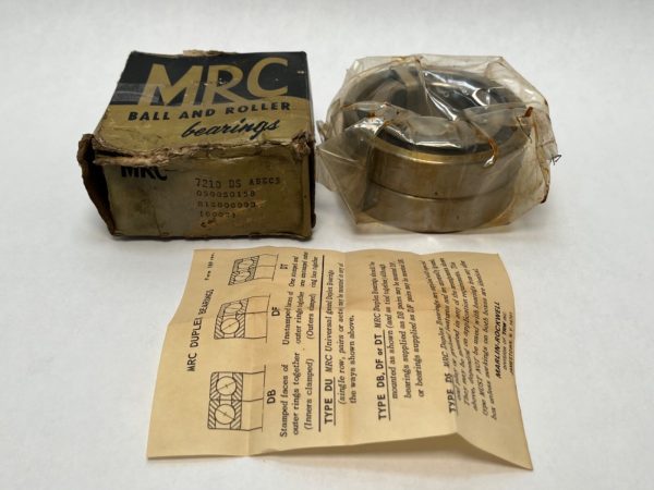 MRC 7210DS angular contact ball bearing in plastic wrap next to its original worn box and paper instructions