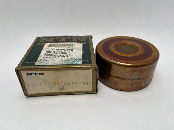 NTN 7407T1GD2GL angular contact ball bearing next to its original labeled NTN packaging box