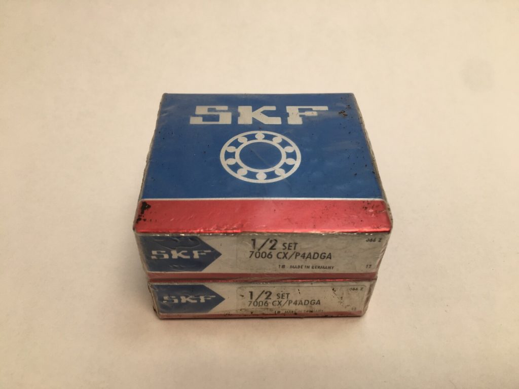 Two stacked SKF 7006 CX/P4ADGA bearing boxes, labeled 1/2 set, made in Germany