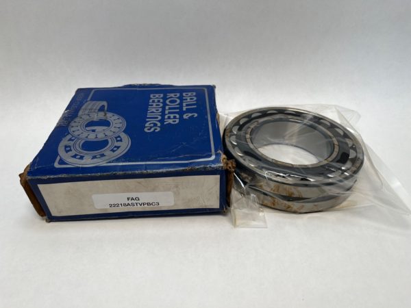 FAG 22218ASTVPBC3W33 spherical roller bearing in plastic wrap next to its blue packaging box