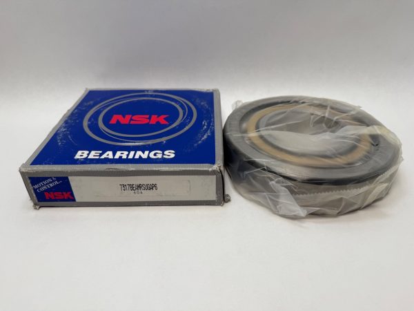 NSK 7317BEAMRSUGAP6 angular contact ball bearing, shrink-wrapped, beside its labeled NSK packaging box