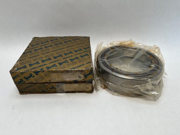 SNR 7020CDUJ74 angular contact ball bearing, shrink-wrapped, next to its original SNR box