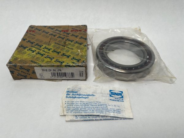 SNR angular contact ball bearing 7012.CV.DU.J74 in sealed bag beside its labeled box and instructions