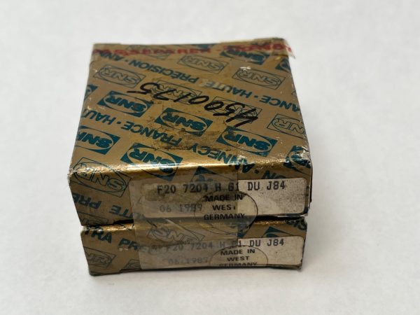 Two stacked gold SNR boxes labeled F20 7204 H G1 DU J84 for a SNR 7204HG1DUJ84 bearing pair