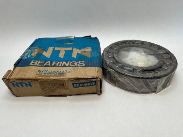 NTN 22220B spherical roller bearing wrapped in plastic beside its original NTN Bearings box