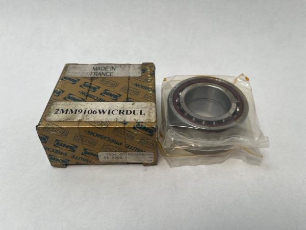 SNR angular contact ball bearing, 30 mm ID, next to its original labeled box