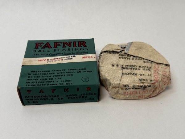 Fafnir MM306WI2 super-precision angular contact ball bearing box next to cloth-wrapped bearing