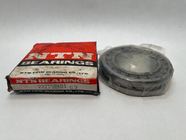 NTN 22215BKD1 C3 spherical roller bearing, shrink-wrapped, beside its original NTN Bearings box
