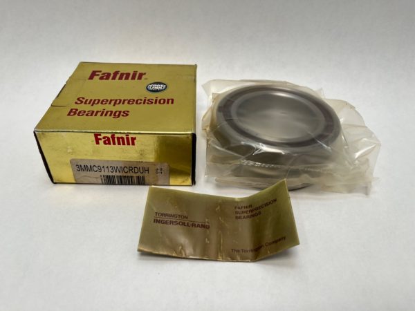 Fafnir 3MMC9113WICRDUH super-precision angular contact ball bearing, shrink-wrapped, beside its gold Fafnir box