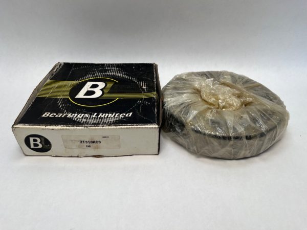 FAG 21318-K-C3 spherical roller bearing wrapped in plastic beside its Bearings Limited box