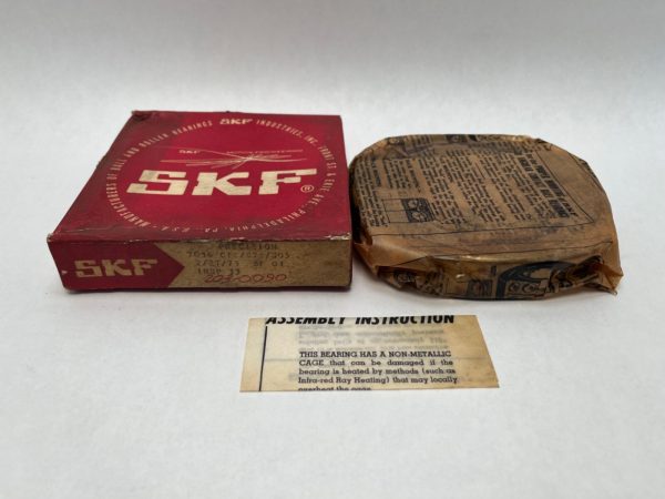 SKF 7016CTCC78 angular contact ball bearing in original box, wax paper wrap, and assembly instructions