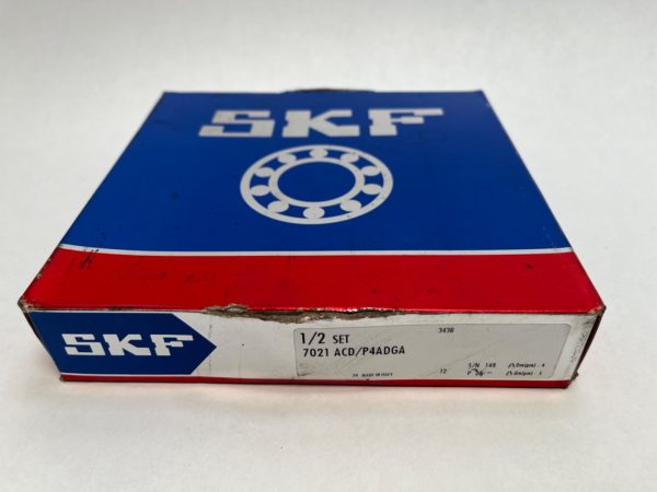 SKF 7021-ACD/P4ADGA angular contact ball bearing box with label showing set and serial number