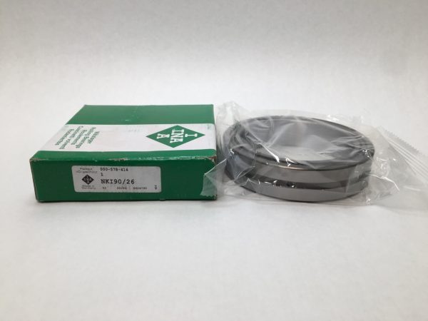 INA NKI90/26 needle roller bearing with inner ring, in plastic packaging beside its green box