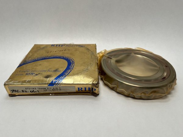 Super precision angular contact ball bearing wrapped in plastic beside its original RHP bearings box