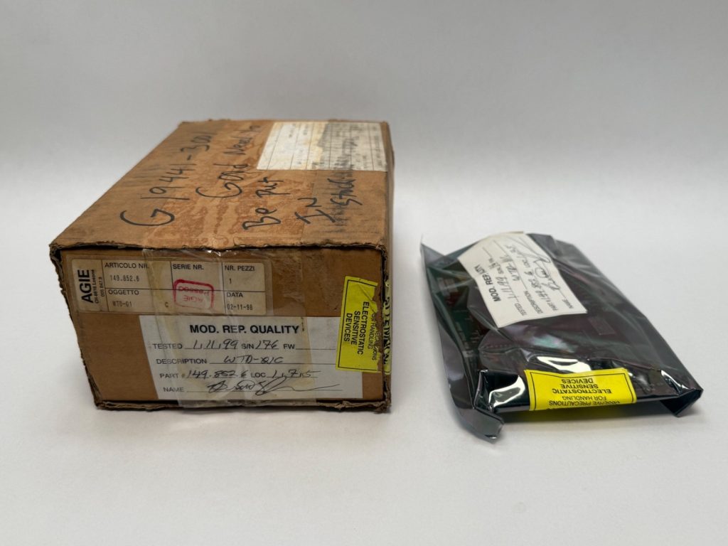 AGIE Wire Touch Device Module in original box beside an antistatic bag with circuit board labeled Part 149.852.6