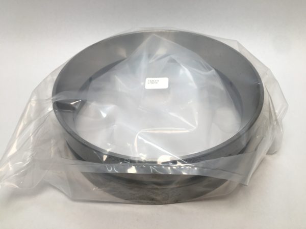 Timken 67820D double tapered roller bearing cup wrapped in plastic on a flat surface